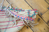 Shaggy ivory pile with hot pink and aqua lattice motif detail on a Moroccan runner.