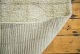 Shaggy platinum ivory pile and woven foundation of a New Moroccan rug runner.