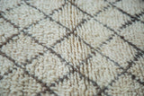 Shaggy ivory pile of vintage Moroccan rug featuring a charcoal lattice design.