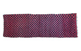 Vintage Moroccan runner rug featuring a striking red and charcoal black checkered pattern, 3'4