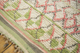 Vintage Moroccan rug with shaggy harlequin diamond lattice in faded pink, green, grey, ivory, and striped border.