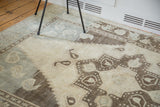 Whimsical geometric motif with blanched ivory, silver, mint, charcoal abrash, vintage Oushak.