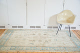 Vintage Oushak rug, pale aqua border with reciprocating motif, platinum ivory field.