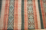 Close-up of charcoal and platinum geometric motifs on vintage Jijim carpet.