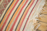 Natural hand-woven fringe and striped body of a vintage kilim runner.
