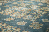 Textured sun kissed aqua teal Oushak rug with geometric beige and bronze motifs.