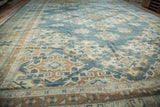 Sun-kissed aqua teal, beige, and bronze geometric motifs on a vintage Oushak rug.