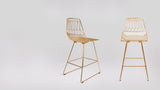 Two modern golden wire Lucy Counter Stools displayed from front and side.