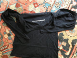 White 'oldnewhouse.com' print on the back of a black long sleeve t-shirt.