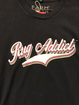 Close-up of the distressed Rug Addict graphic with layered red, blue, and yellow retro lettering.