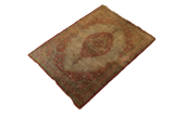 The complete form and aged character of a late 19th-century Persian silk Tabriz rug mat.