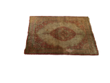 Perspective view of a rare antique Haji Jalili Tabriz silk mat showing its overall character and patina.