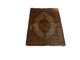 A rare antique silk Tabriz mat showing the full intricate pattern with its rust and orange medallion.