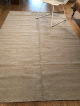Close-up detail of the Dawn New Carpet's grey and beige woven chevron pattern.