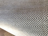 Handmade gray and cream geometric zigzag pattern of the Dawn carpet.