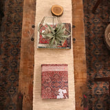 Old New House Rug Coloring Book styled on a rustic wood table with a vintage rug.