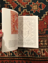 An open page of the rug coloring book showing a Turkish Oushak design and reference photo.