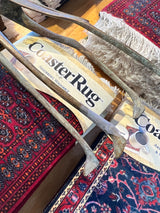 Taped repair on a foot of the vintage oxidized giraffe sculpture.