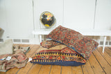 Vintage Camel Hair Serab floor pillow, square, with bold geometric patterns, navy backing.