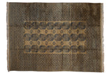 Vintage Ersari carpet with triple columns of navy blue elephant footprint guls on a camel ground.