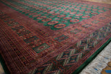 Detailed rust and emerald green Bokhara carpet borders and gul medallions, with fringe.