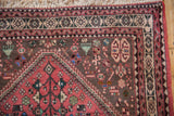 Vintage Persian Abadeh rug: ivory fringe, dusty blush geometric border, coffee brown field with plant motifs.