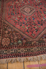 Vintage Abadeh rug corner with beige fringe, geometric border, and coffee brown spandrel.