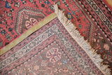 Tightly hand-knotted foundation, natural fringe, and dusty blush tones of a vintage Abadeh rug.