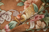 Vintage Art Deco carpet's dimensional carved foliage and texture in blush, jade, and copper.