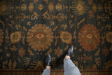 Vintage Indian Bijar rug detail with dusty navy ground, terracotta palmettes and reciprocating vinery.