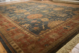 Terracotta border with dusty blue palmette field and light fringe on a vintage Bijar rug.