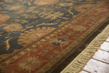 Vintage Indian Bijar design carpet with terracotta border, dusty ink blue field, and fringe.