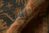 Full pile detail of dusty blue and terracotta palmettes with reciprocating vinery.