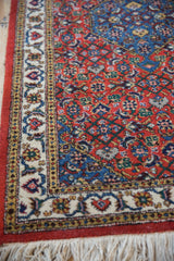 Intact original selvage and plush wool pile on the corner of a vintage Persian Ardebil rug.