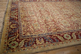High luster wool pile on the corner of a vintage Indian rug, detailing the scrolling palmette border.
