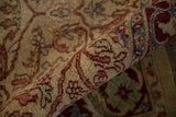 Close-up of the lustrous, dense wool pile and palmette border on a vintage Indian carpet.