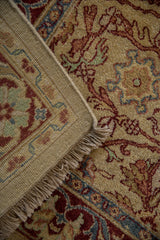Hand-knotted vintage carpet corner showing its solid woven back, original side cord, and fringe.