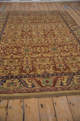 Low angle view across the lustrous dusty gold pile, highlighting the scrolling floral lattice design.