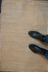 Amber Jute hand-woven rug with natural blanched texture and neutral tone.