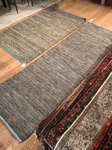 Hand-woven texture of Clay New Carpet, showing blended recycled leather and jute.