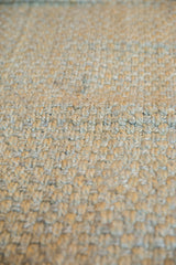 Chunky woven texture of Elsa Jute rug with blue-gray and natural fibers.