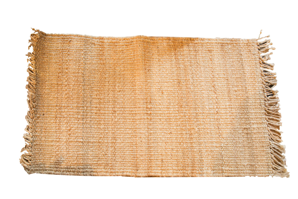 Handmade natural jute rug from New Carpet Collection, textured weave with fringe, 2'3" x 4'.