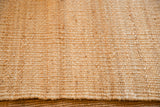 Detailed texture of a natural jute handwoven rug.