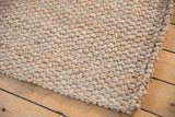 Saratoga Jute rug's chunky natural beige and tan texture.