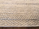 Textural undyed pure wool Snow rug with chunky, handmade loops.