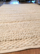 Chunky, hand-braided texture of the undyed pure wool Snow New Carpet rug.