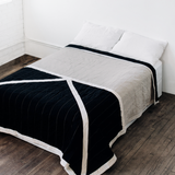 Louise Gray No. 1 quilt featuring a modern black, cream, and flax geometric design.