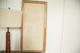Tom Tru wooden panel art, back view with natural wood frame and artist label.