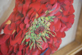 Layered dark pink and green petals of Maria Heller's hand-painted 3D flower art.