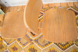 Overhead view of curved light wood grain on a vintage Thonet style chair.